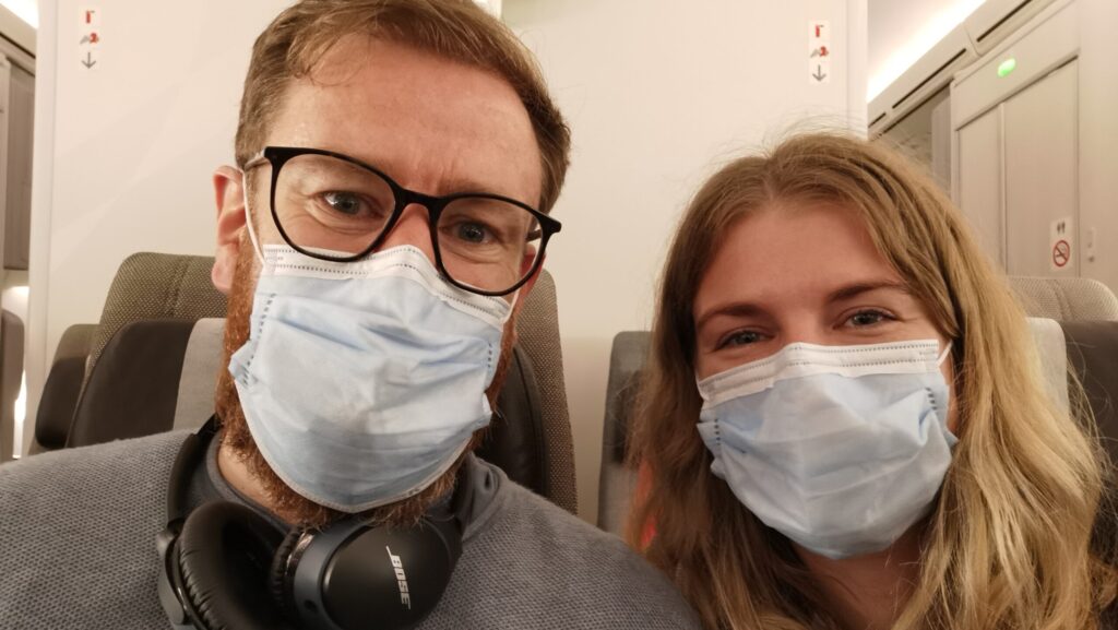 A couple wearing covid masks