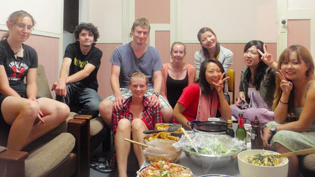 Friends sitting around a table enjoying a meal