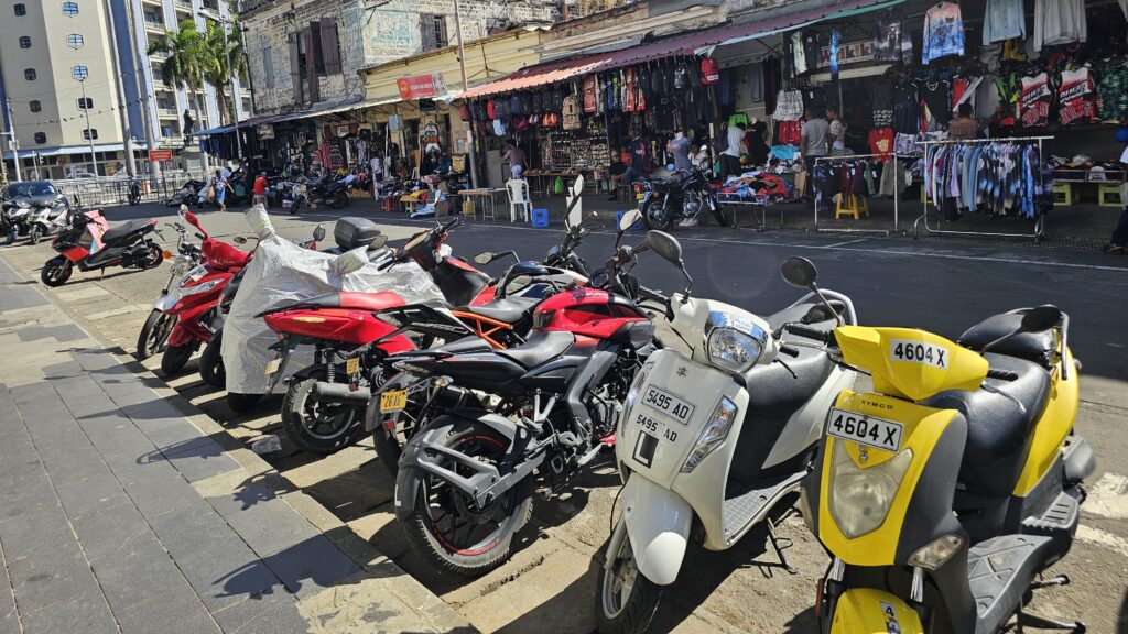 Line of motorbikes outside Port Louis market
