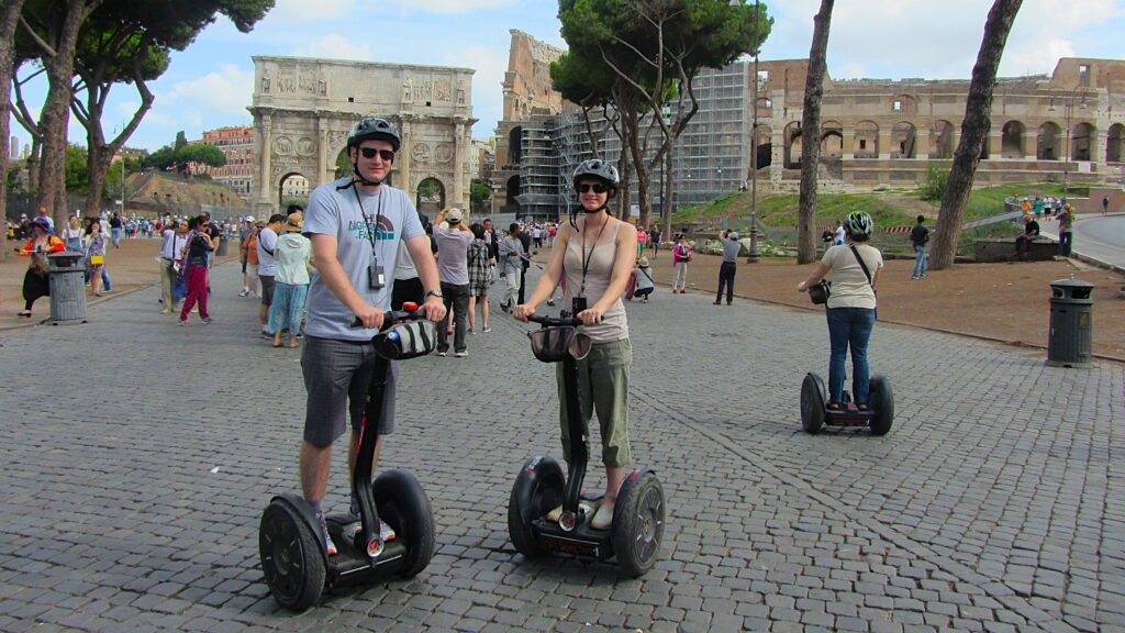 Couple on segways outside the Rome Colosseum