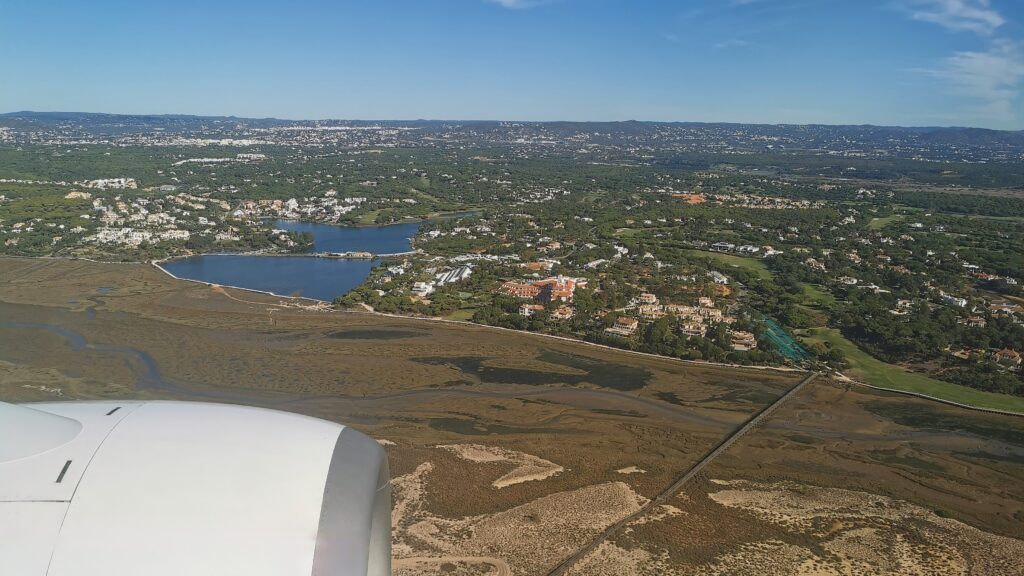 A view from an airplane of a green landscape