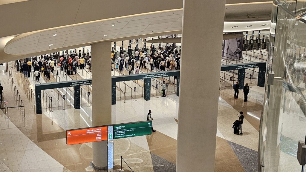 People queuing at passport control e-gates