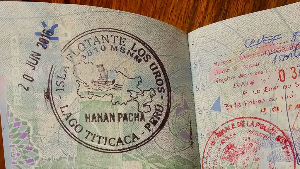 Passport page showing a stamp from Uros Island on Lake Titicaca