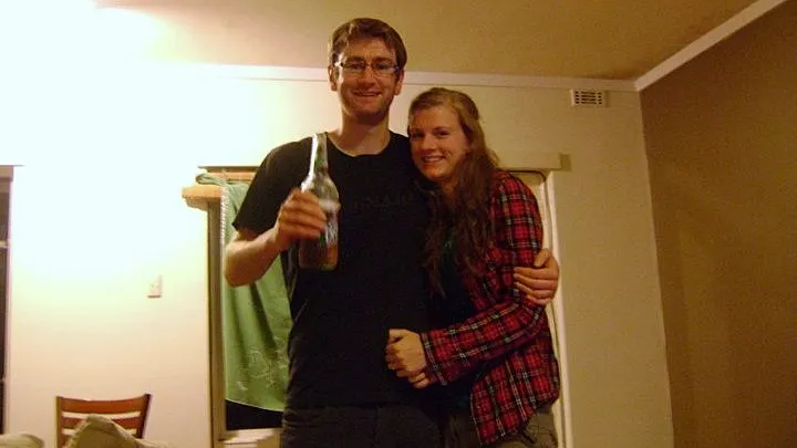 Couple raising a beer to celebrate the birth of their nephew