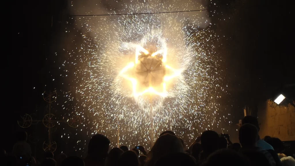 A dark image with only the light from a firework showing