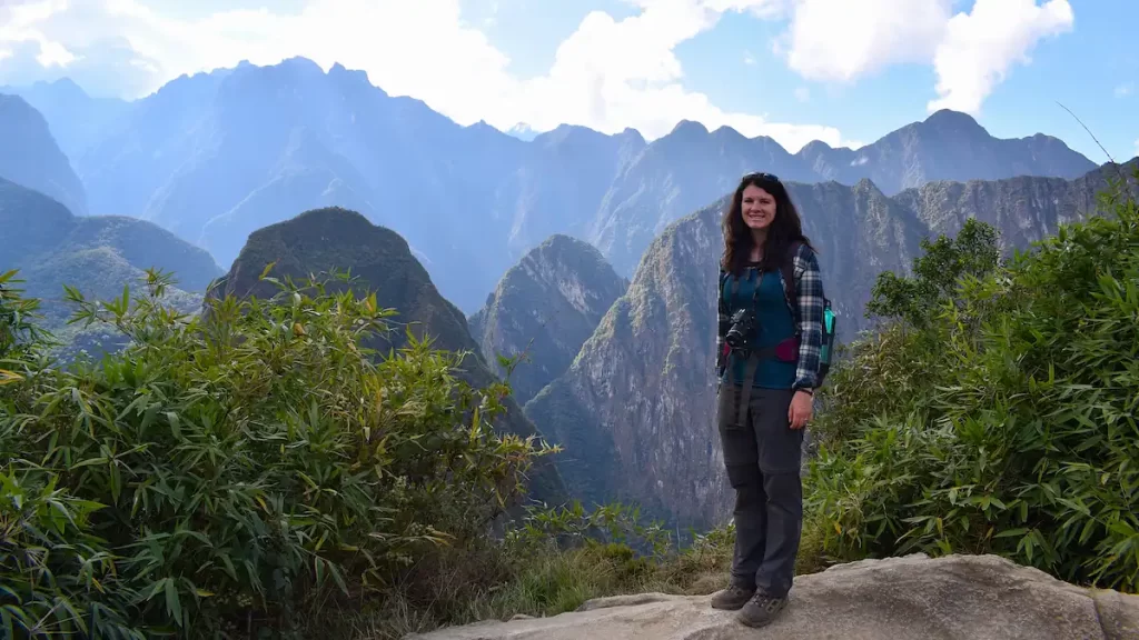 A woman in hiking gear in the mountains of Peru