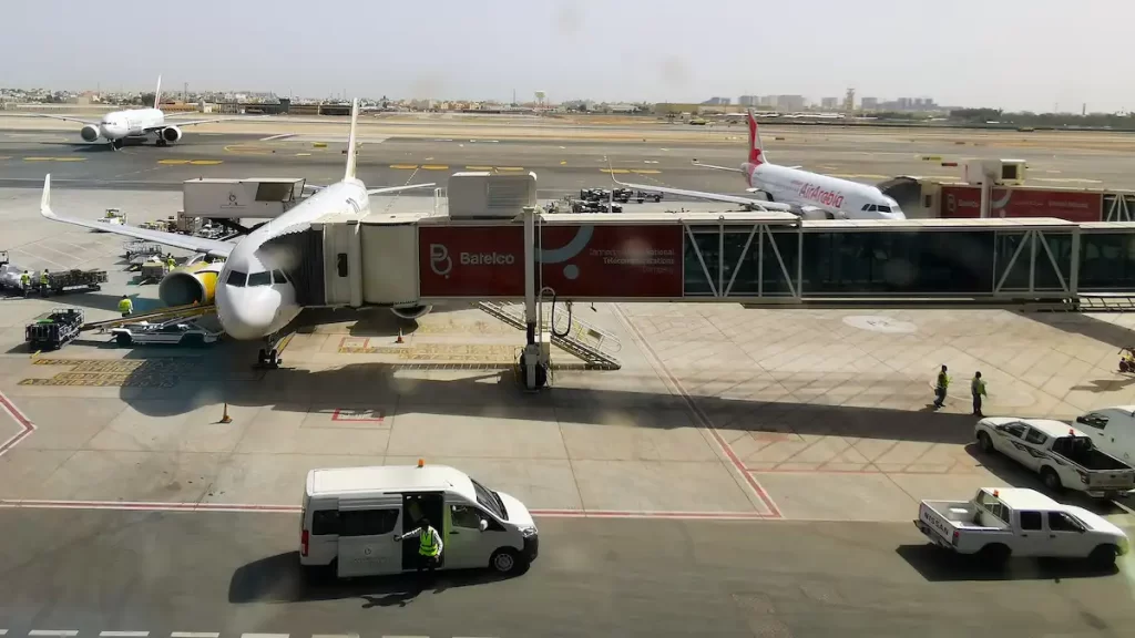 Looking out a window at airplanes at an airport