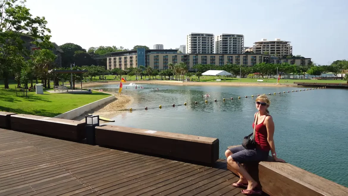 Woman sat on the waterfront in Darwin, Australia