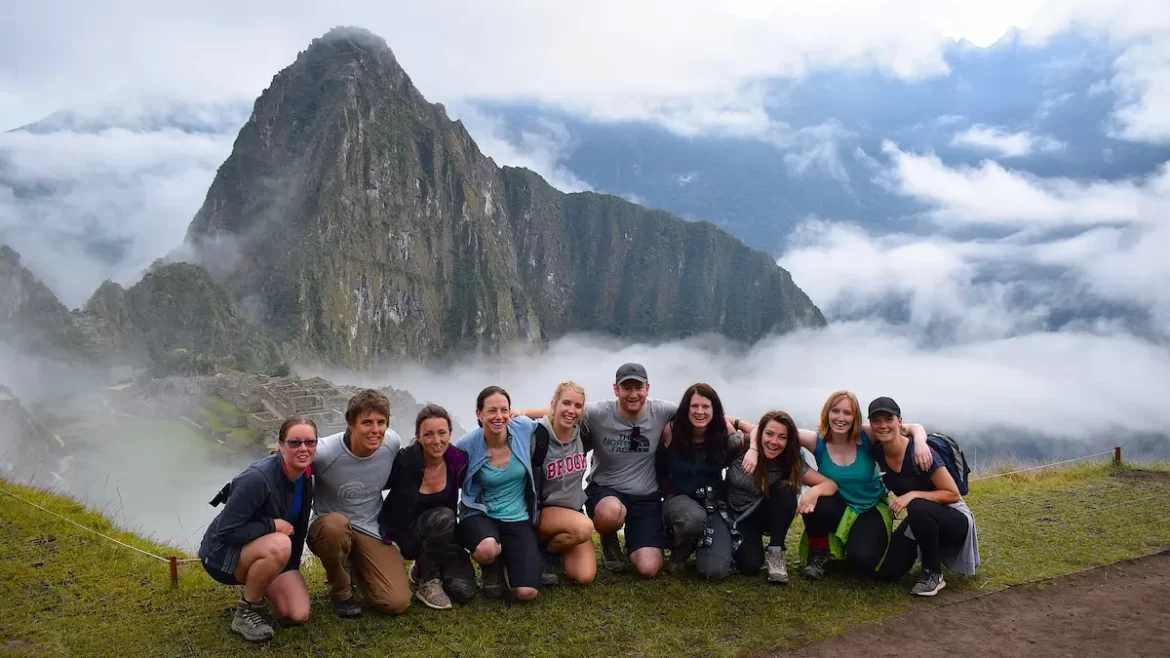 A group of young adults on top of Machu Picchu