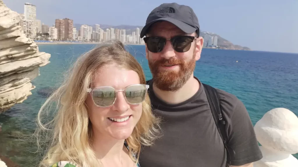Couple posing with Benidorn skyline in the background