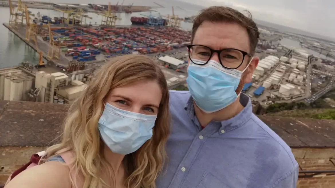 A man and woman wearing Covid face masks