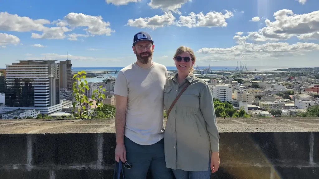 Young couple posing with a view over Port Louis, Mauritius on a sunny day