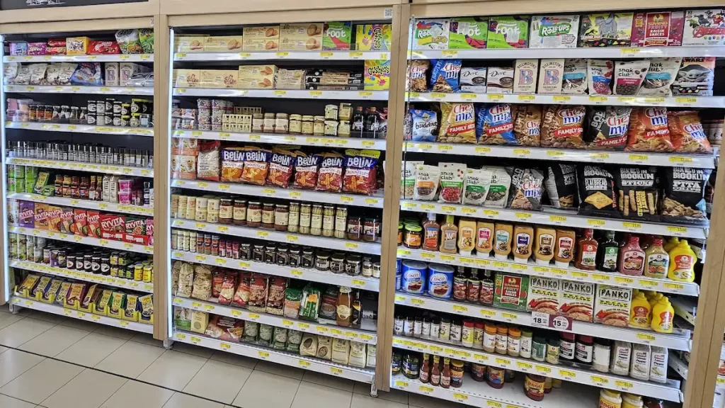 A supermarket shelf full of dry goods