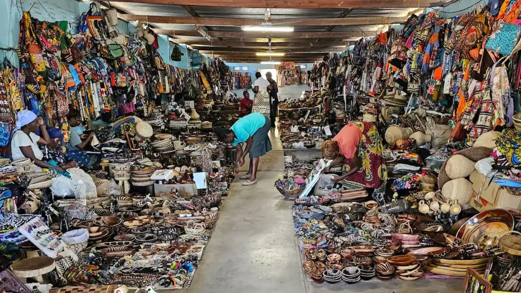 Indoor market selling textiles and wooden souvenirs in Zimbabwe
