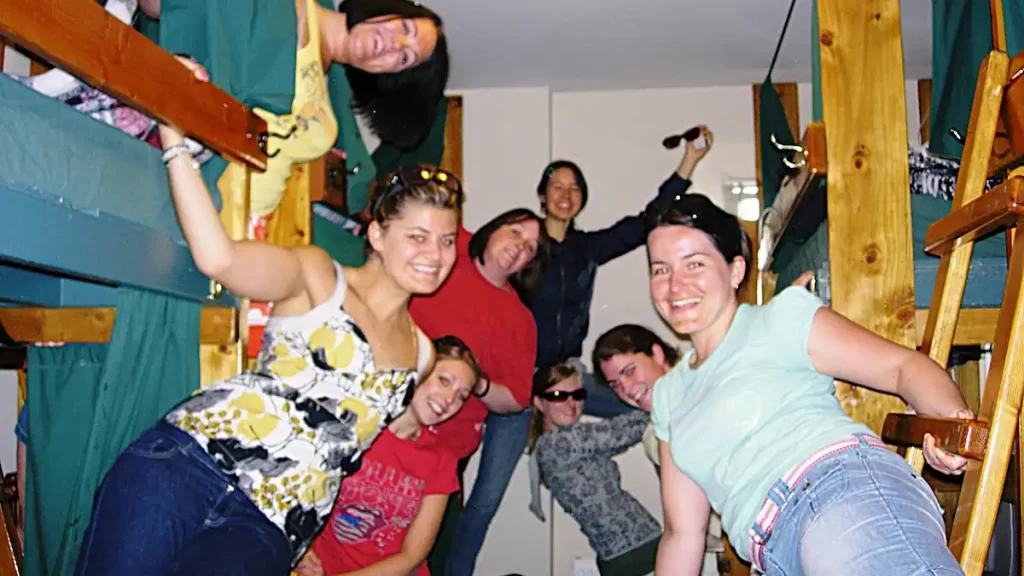 Group of young females hanging off bunk beds