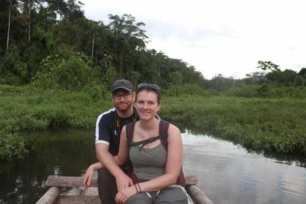 Sue and Jon on a wooden raft in the Amazon rainforest